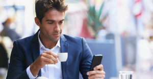 business man looking at smart phone